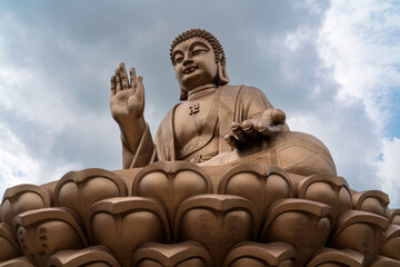 The Great Buddha Statue in the Nanshan scenic area of the Jiaodong Peninsula on a sunny summer day,...