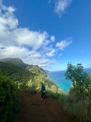 Backpacker hiking on mountains on the coast