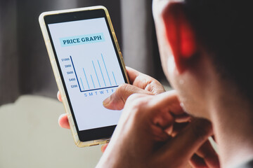 Man using his phone to check the Price Graph for a week. Dynamic pricing strategy concept for airline tickets, hotel room rates, gold and time based services.