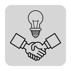 Two hands shaking in gesture of agreement, positioned beneath light bulb. Collaboration, innovation, and sharing of ideas concept