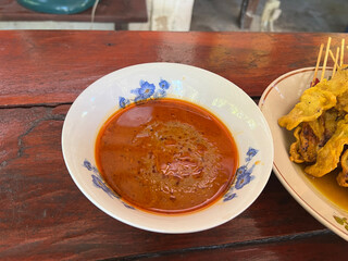 thai food, spicy pork with sticky rice, fried egg and chili sauce