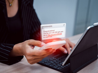 SMS scam, lottery link from scammer for malware installing concept. Winning prize congratulations, phishing text message showing while business woman use mobile phone and working with tablet computer.