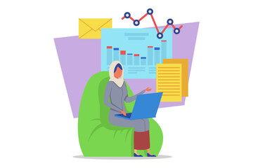 Woman wearing headscarf while sitting on comfortable chair, working on laptop. Charts and documents in background, indicating busy home office environment