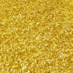Gold foil leaf shiny texture, abstract yellow wrapping paper for background and design art work.