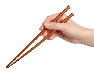 A fair-skinned hand holds a pair of brown wooden chopsticks against a white background