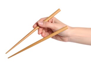 A fair-skinned hand holds a pair of light brown chopsticks against a white background