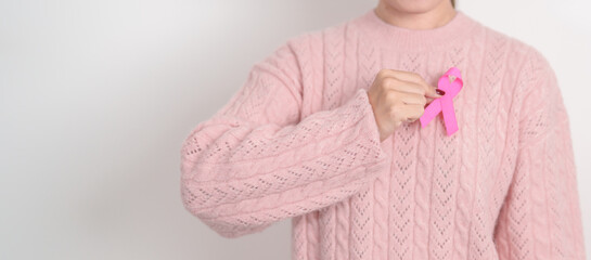 Pink October Breast Cancer Awareness month, woman with pink Ribbon for concepts of support people life and illness. National cancer survivors month, Women Health day and February World cancer day