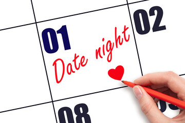 1st day of the month.  Hand writing Date night reminder and drawing a red heart on calendar with...