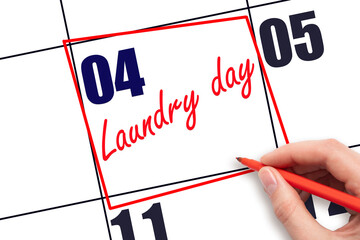 4th day of the month.  Hand writing Laundry day reminder and drawing red frame on calendar with red...