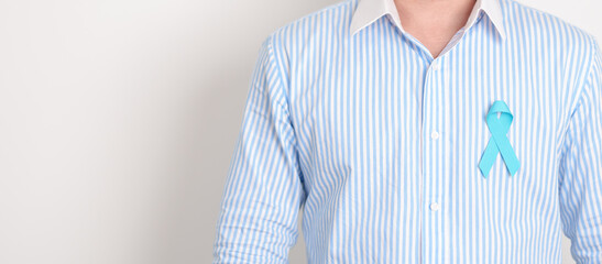 Man with blue Ribbon for concept of blue November, November Prostate Cancer Awareness month, World...