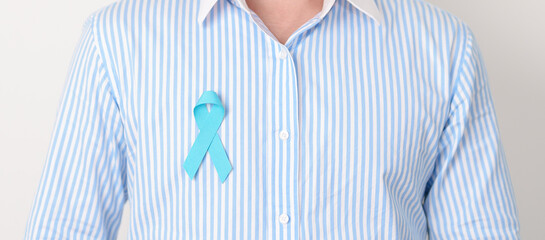 Man with blue Ribbon for concept of blue November, November Prostate Cancer Awareness month, World...
