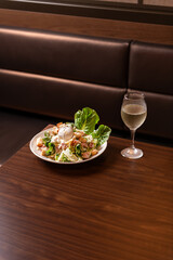 White Wine Glass With Caesar Salad