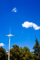 A cloud below the trees in the park