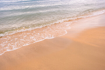 Beach sand background for summer vacation concept. Beach nature and summer seawater with sunlight light sandy beach Sparkling sea water	