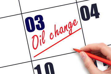 3rd day of the month.  Hand writing Oil change reminder and drawing a line on calendar with red pen...