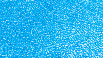 Top view beach sand background for summer vacation concept. Beach nature and summer seawater with sunlight light sandy beach Sparkling sea water 