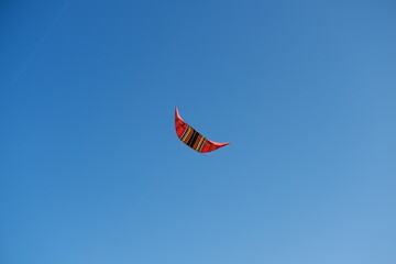 Colorful Kites Flying in Bright Blue Sky