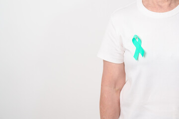 Elderly with Teal Ribbon for September Ovarian Cancer Awareness month, PCOS, January Cervical...