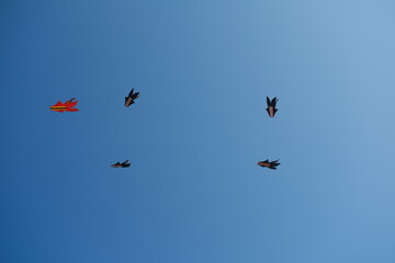 Colorful Kites Flying in Bright Blue Sky