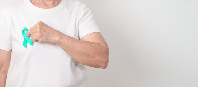 Elderly with Teal Ribbon for September Ovarian Cancer Awareness month, PCOS, January Cervical Cancer, April Sexual Assault, June PSTD, Post Traumatic Stress Disorder, May Tourette syndrome