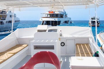 Luxury yachts anchored in clear blue sea