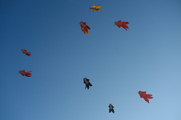 Colorful Kites Flying in Bright Blue Sky
