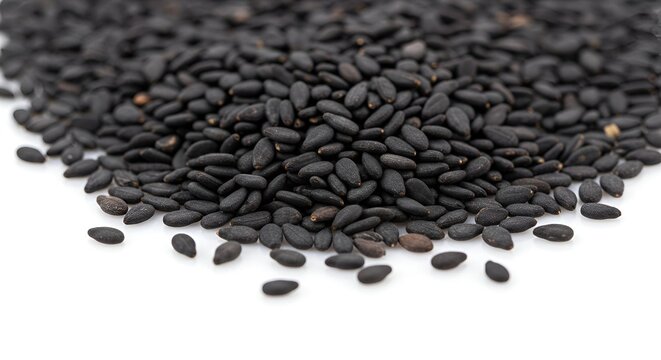 Black Sesame Seeds Pile on White Background