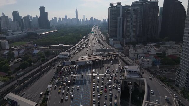City Landscape And Road Traffic During Rush Hour On The Si Rat Expressway In Bangkok, Thailand. Aerial Drone Shot