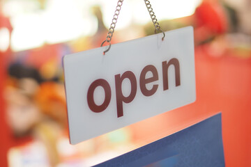 Shop sign indicating it is open for business today