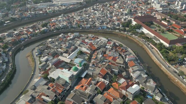 Dense Neighborhood In Tebet Jakarta As Muddy Canal Winds Throughout Drone Track Forward 4K 60FPS