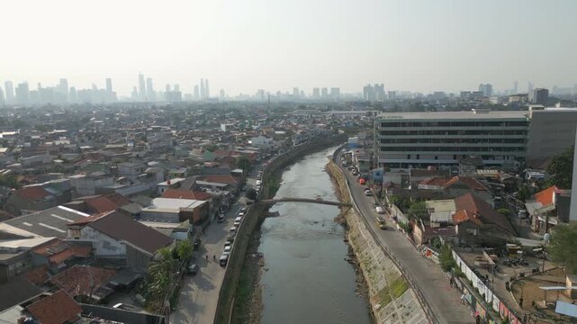 Canal Winds Through Tebet Neighborhoods Jakarta Indonesia Drone Rise 4K 60FPS