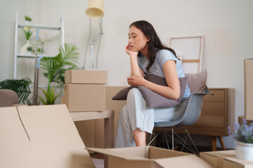 Asian Adult Woman Feeling Exhausted Overwhelmed Moving New Home Unpacking Cardboard Boxes Alone...