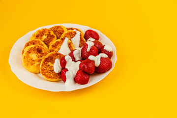 Delicious breakfast plate with pancakes and strawberries