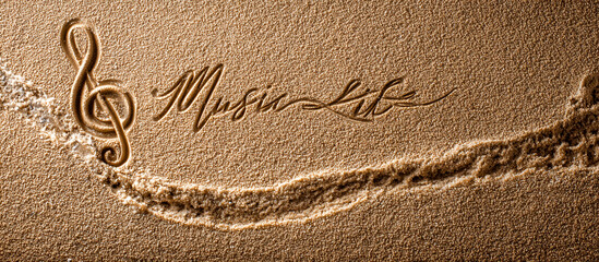 Music is Life Message in Smooth Wet Sand with Minimalist One-Line Treble Clef Drawing Near Shoreline – Wide Composition for Artistic Music Promotions