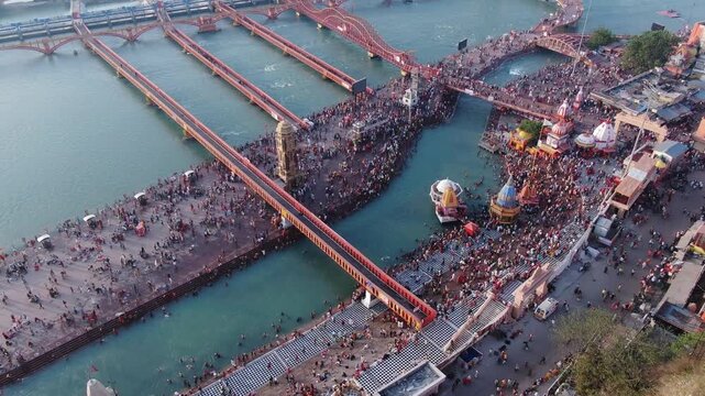 4k Aerial Drone shot of huge crowd at river ganges  har ki pauri  during a hindu festival Kumbh Mela in Haridwar , Uttarakhand,India 
