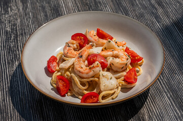 Pasta with shrimp and tomatoes. 