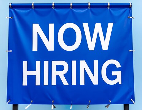Vibrant blue recruitment sign, showcasing job opportunities and career growth announcements