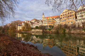 Historic German old town on the riverbank. Reflections of half-timbered houses in the water....
