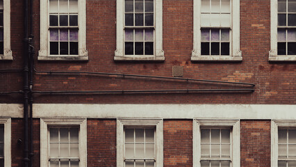 Vintage red brick building showcasing historic English architectural details