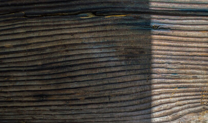 Wooden background with light and shadow. Texture of old wood.