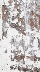 Textured white wall with peeling paint for use as rustic vintage background