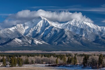 Snowy mountain range under a blue sky