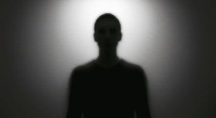 silhouette of a man standing in front of a wall, Vintage distressed scratched old photo light leaks, film grain, dust and scratches texture overlay with vignette border. Dirty grunge analog 8k widescr