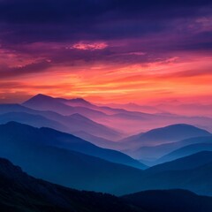Fototapeta premium Breathtaking Vibrant Sunset Over Layers of Mountain Ranges