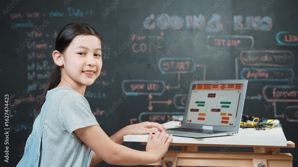 Poster asian student programming engineering code or prompt with equipment on table while turn around to lo