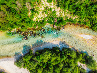 Rafting and kayaking place on the river. Kayakers in colorful life jacket paddling in Soca river,...