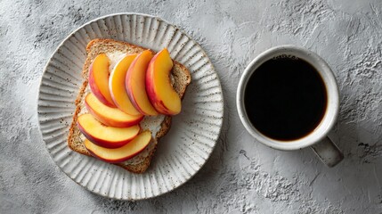 Flat lay of a minimalist breakfast scene with toast, peach slices, and black coffee