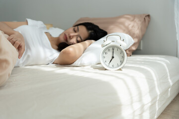 Simple lifestyle, Asian woman sleep well from good sleep on weekend morning, takes some rest, enjoy...