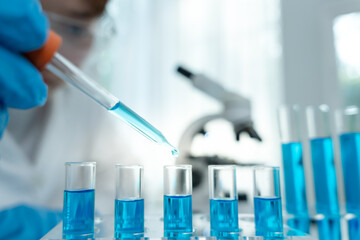 Scientist analyze biochemical samples in advanced scientific laboratory. Medical professional use...