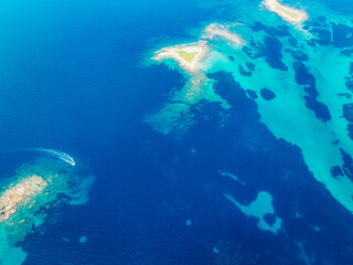 Seacoast with shades of turquoise water with beaches and blue lagoons in Karidi in Sithonia Peninsula, Vourvourou bay, Halkidiki, North Greece
